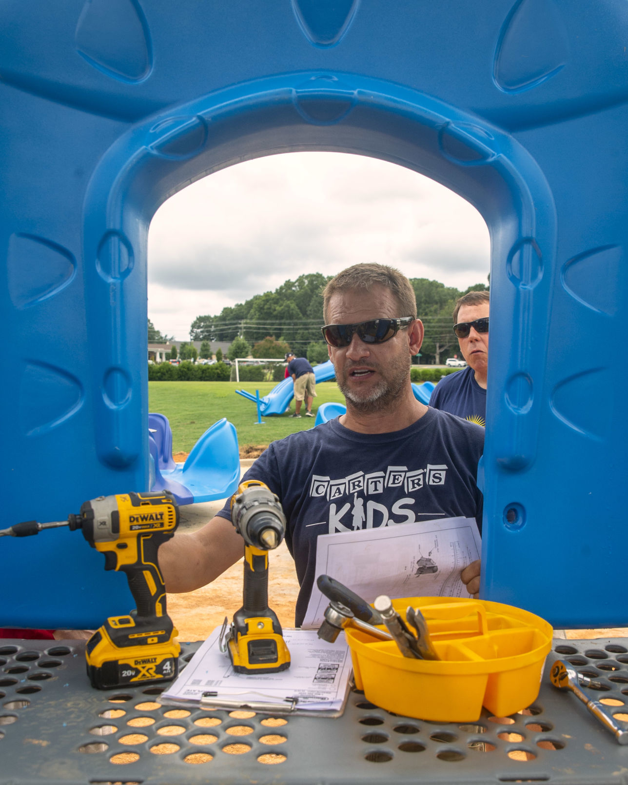 Volunteers assemble playground